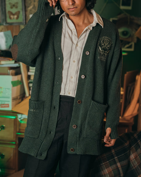 Magnus Archives x Knock Thrice oversized knit cardigan with embroidered details in dark green. Made of 60% Cotton 30% Nylon 10% Wool.