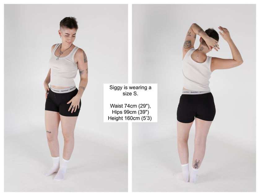 Knock Thrice Knoxers // black cotton, fitted, unisex boxer briefs. The boxers are mid-high rise,  and have a grey spandex waistband that reads 