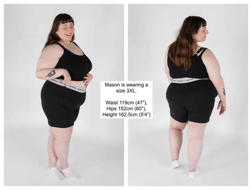 Knock Thrice Knoxers // black cotton, fitted, unisex boxer briefs. The boxers are mid-high rise,  and have a grey spandex waistband that reads 