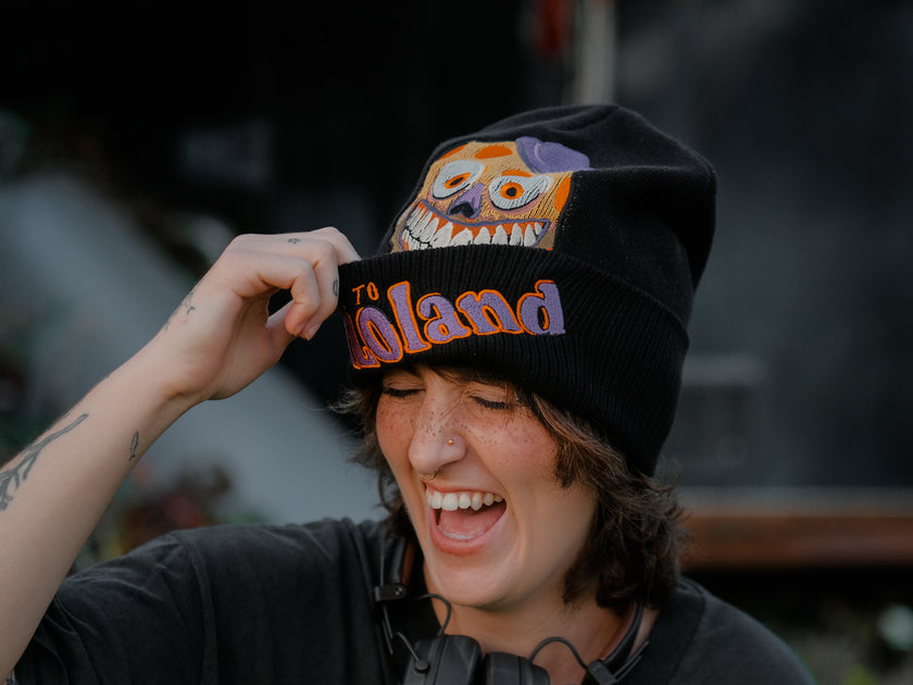 Knock Thrice x Rusty Quill â€œWelcome to Bonzoland!â€ black Knit Beanie from The Magnus Protocol. The beanie features Mr. Bonzoâ€™s happy face and hidden horrors beneath the brim. Ribbed band with â€˜Welcome to Bonzolandâ€™ embroidery.