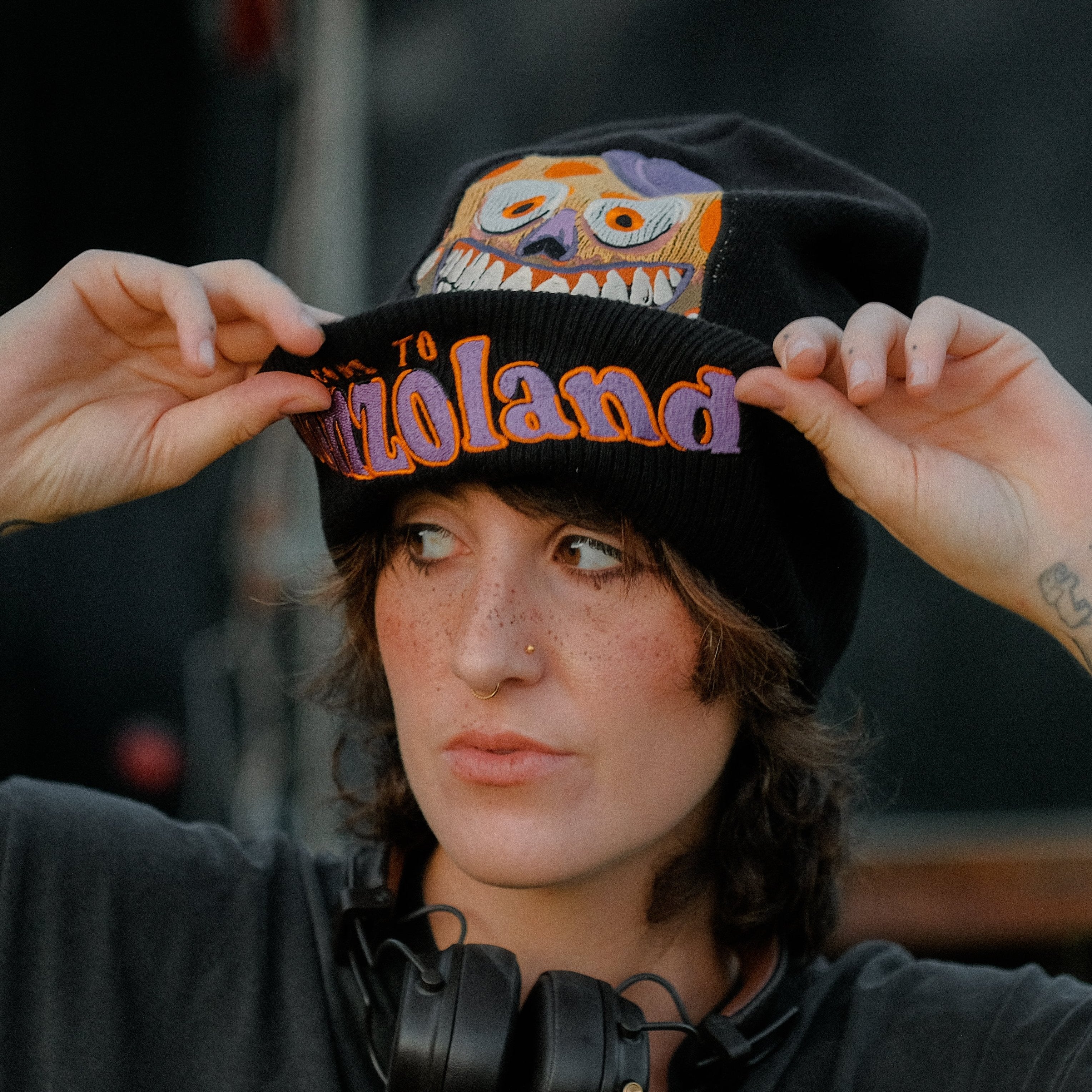 Knock Thrice x Rusty Quill â€œWelcome to Bonzoland!â€ black Knit Beanie from The Magnus Protocol. The beanie features Mr. Bonzoâ€™s happy face and hidden horrors beneath the brim. Ribbed band with â€˜Welcome to Bonzolandâ€™ embroidery.