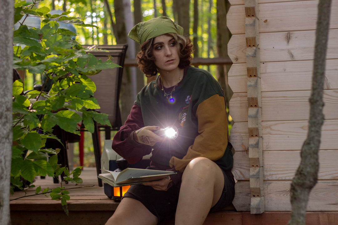 Cozy Forest green, deep yellow, and burgundy cotton crewneck sweatshirt, featuring a vintage, 80â€™s summer camp style embroidered â€œiron onâ€ patches, designed with cryptid-themed symbols and text.
