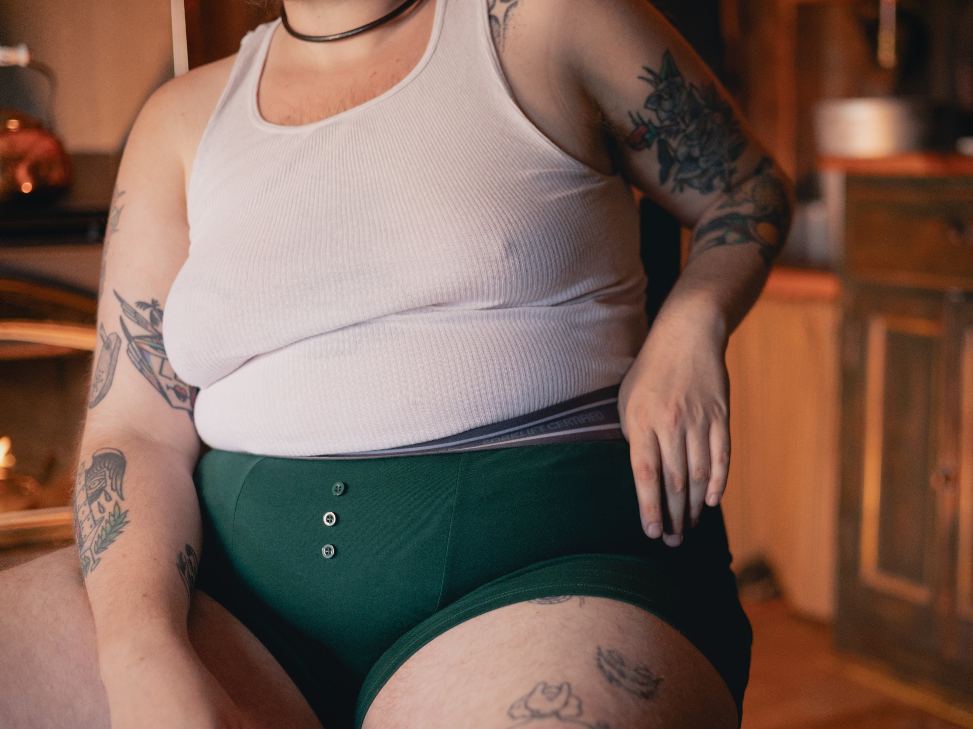 Knock Thrice Knoxers // forest green cotton, fitted boxers. The boxers are mid-high rise,  and have a grey spandex waistband that reads 