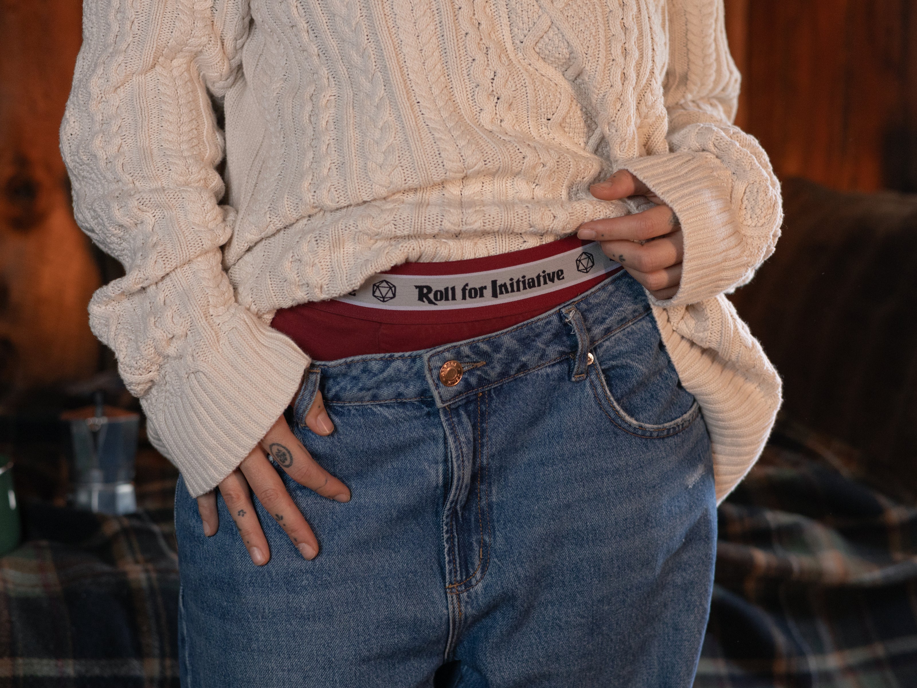 Knock Thrice Knoxers // red cotton, fitted boxers. The boxers are mid-high rise, and have a red and white spandex waistband that pictures a DnD dice and reads 