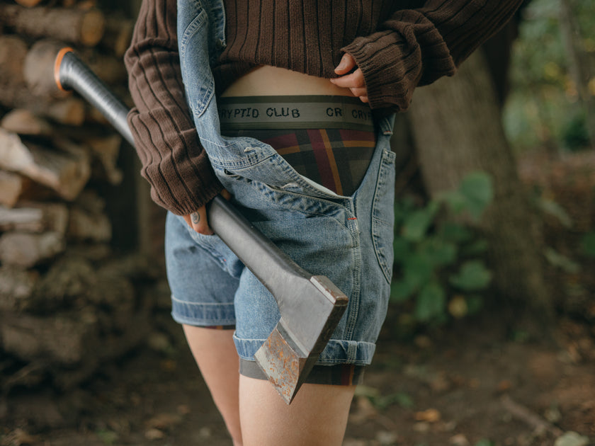 Knock Thrice Knoxers // burgundy, olive green, and mustard yellow plaid, cotton, fitted boxers. The boxers are mid-high rise,  and have a green and grey spandex waistband that reads 
