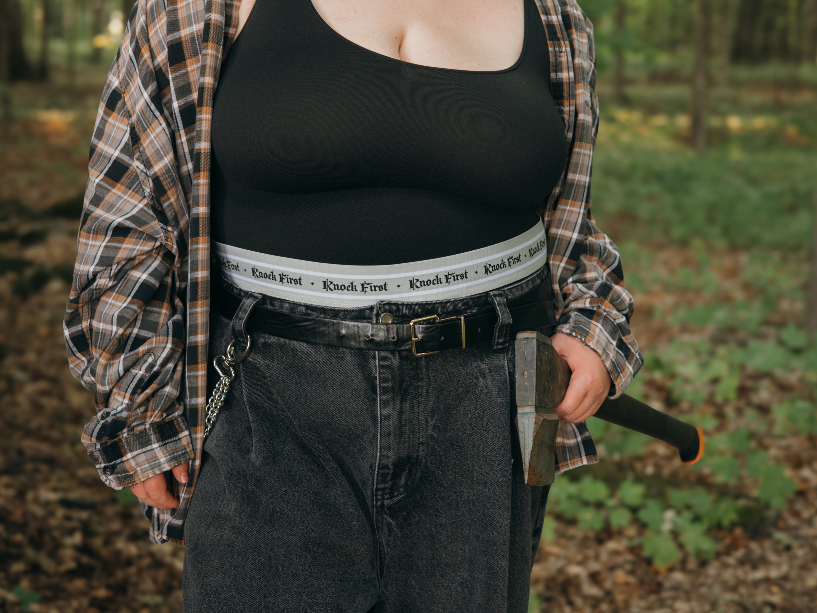 Knock Thrice Knoxers // black cotton, fitted, unisex boxer briefs. The boxers are mid-high rise,  and have a grey spandex waistband that reads 