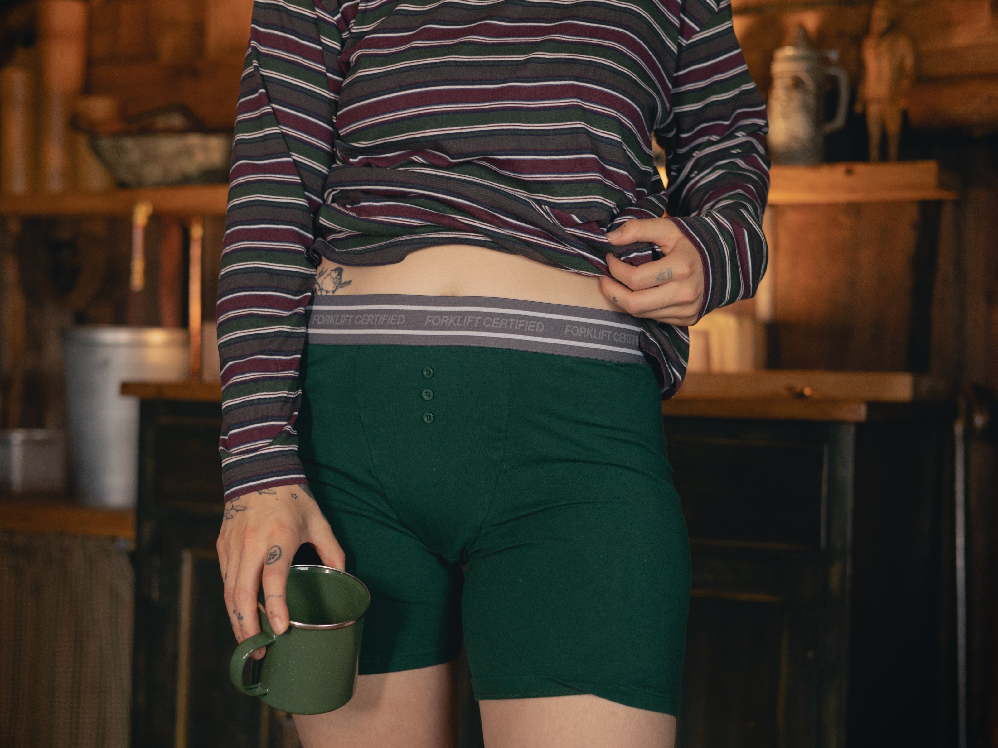 Knock Thrice Knoxers // forest green cotton, fitted boxers. The boxers are mid-high rise,  and have a grey spandex waistband that reads 