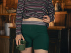 Knock Thrice Knoxers // forest green cotton, fitted boxers. The boxers are mid-high rise,  and have a grey spandex waistband that reads 