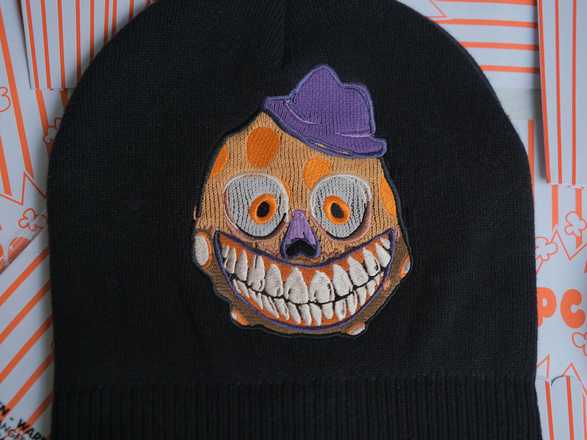 Knock Thrice x Rusty Quill â€œWelcome to Bonzoland!â€ black Knit Beanie from The Magnus Protocol. The beanie features Mr. Bonzoâ€™s happy face and hidden horrors beneath the brim. Ribbed band with â€˜Welcome to Bonzolandâ€™ embroidery.