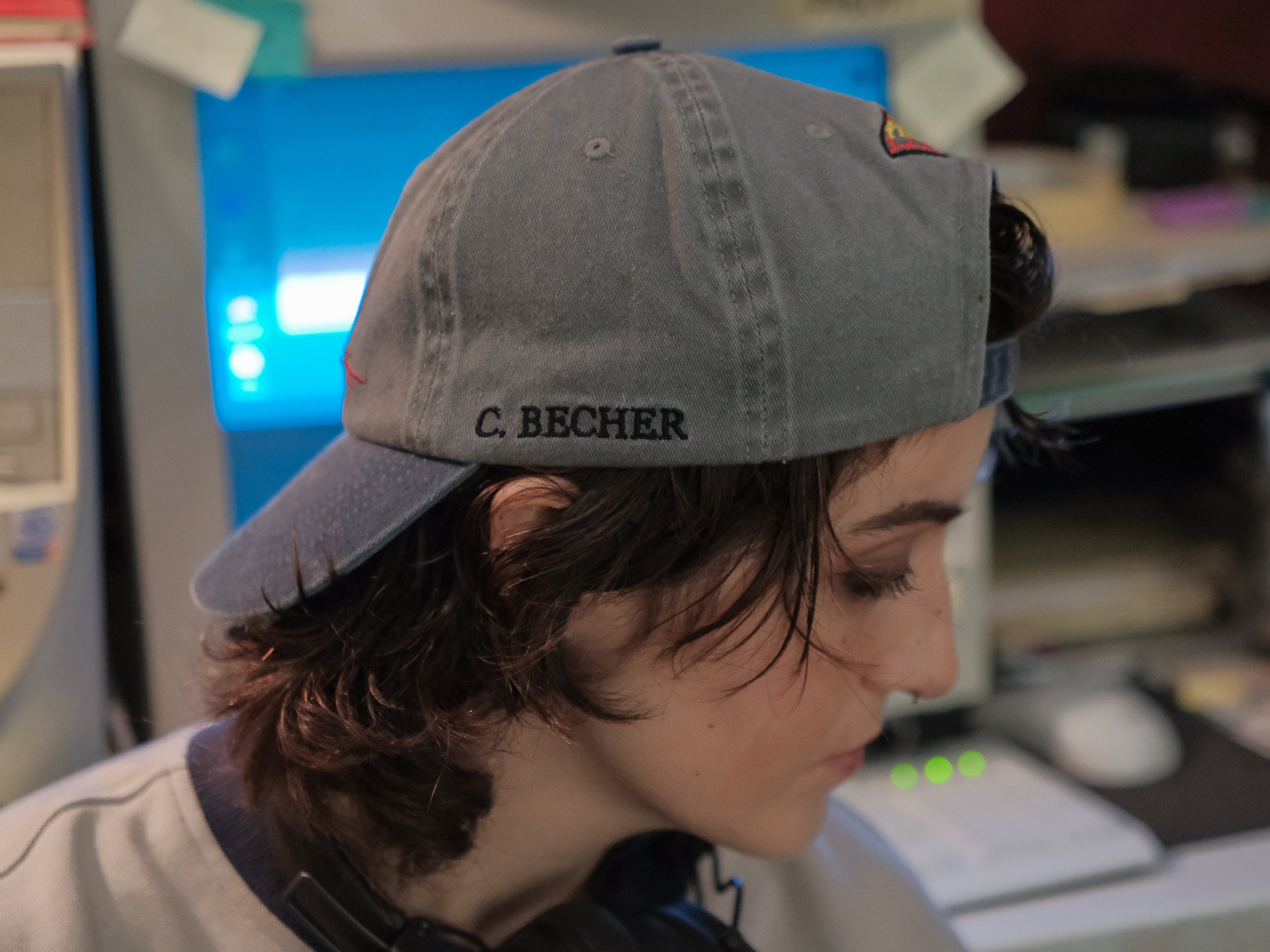 Knock Thrice x Rusty Quill, 100% cotton I.T Department Dad Cap in blue and grey. The hat features an embroidered design of a corrupted computer and glitched OIAR logo, and an adjustable fit.