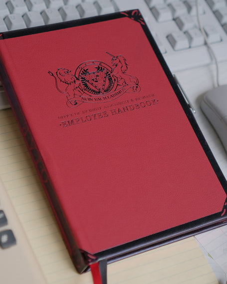 Read and black hardcover journal with 200 cream, 120gsm pages. Featuring double satin ribbon bookmark and pen strap with pen included.
