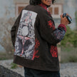 Red and black stone-washed cotton denim jacket, featuring two large front pockets, two inner pockets, and embroidered and patchwork detailing.