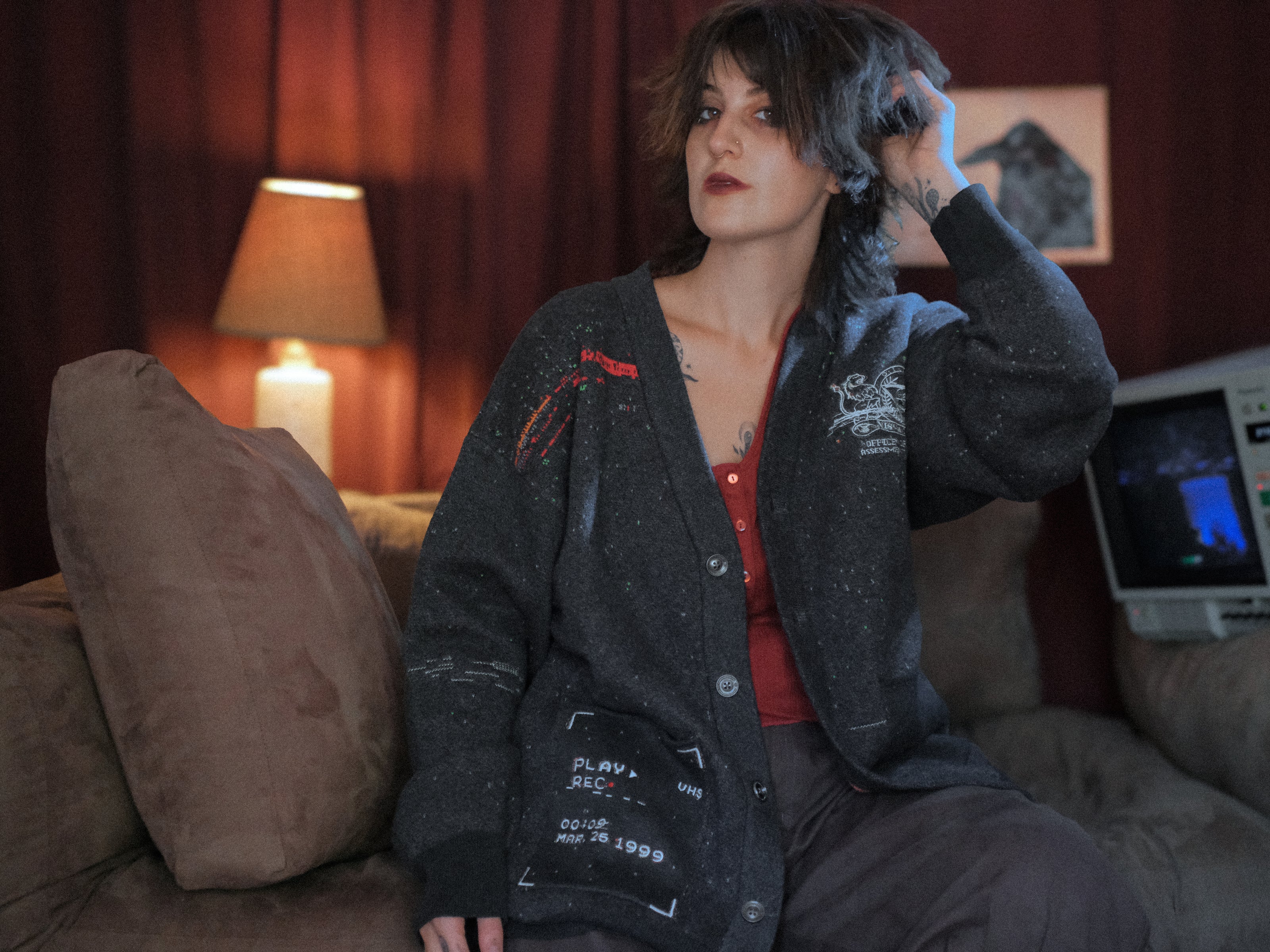 Magnus Protocol, oversized, knit-cardigan, in black. The cardigan is inspired by old cassette tapes, and features embroidered analog details, and the OIAR crest.