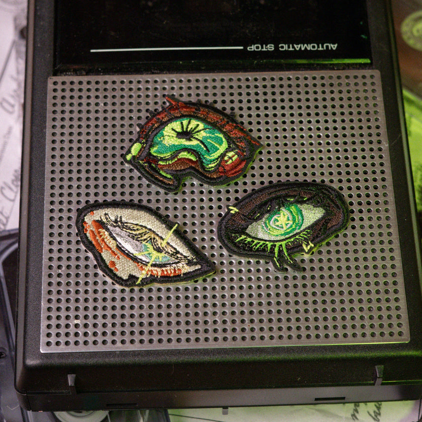 Magnus Archives x Knock Thrice embroidered patch set, made with 100% polyester threads.