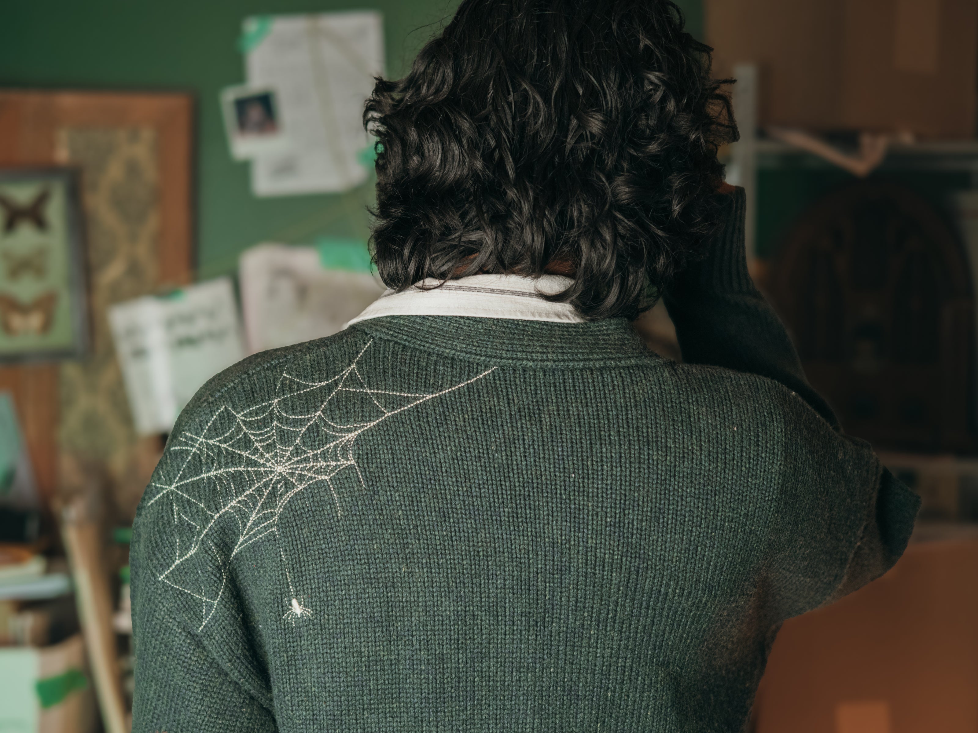 Magnus Archives x Knock Thrice oversized knit cardigan with embroidered details in dark green. Made of 60% Cotton 30% Nylon 10% Wool.