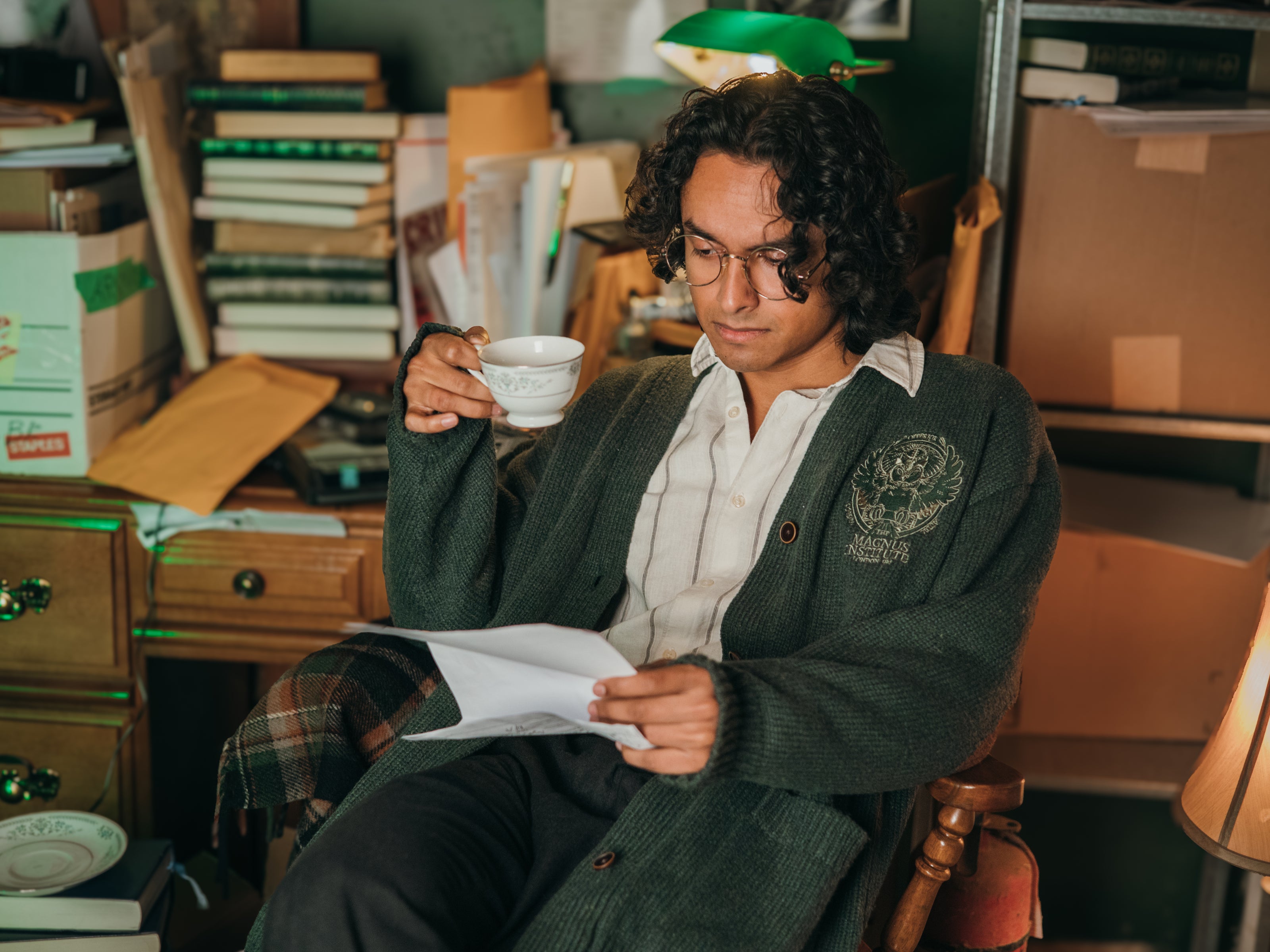 Magnus Archives x Knock Thrice oversized knit cardigan with embroidered details in dark green. Made of 60% Cotton 30% Nylon 10% Wool.