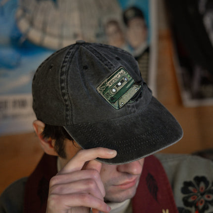 Black and green 100% cotton, 6-panel dad cap. Low profile, one size, with embroidered detailing on the front and back