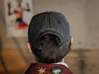 Black and green 100% cotton, 6-panel dad cap. Low profile, one size, with embroidered detailing on the front and back