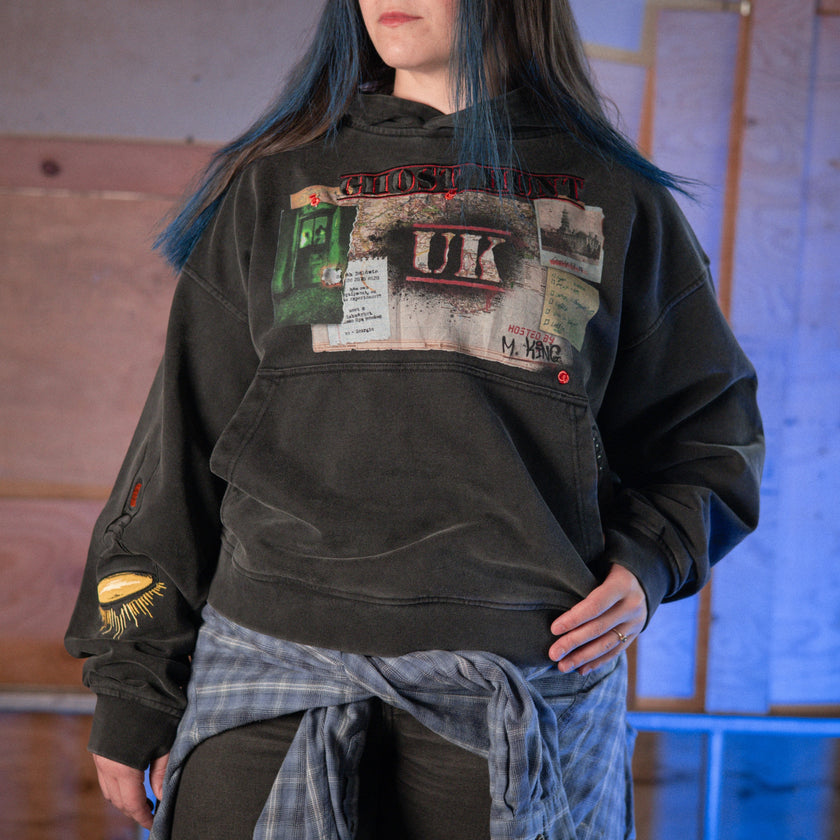 Rusty Quill X Knock Thrice 100% cotton hoodie in black, with a boxy, oversized, slightly cropped fit. The hoodie features both printed and embroidered details.