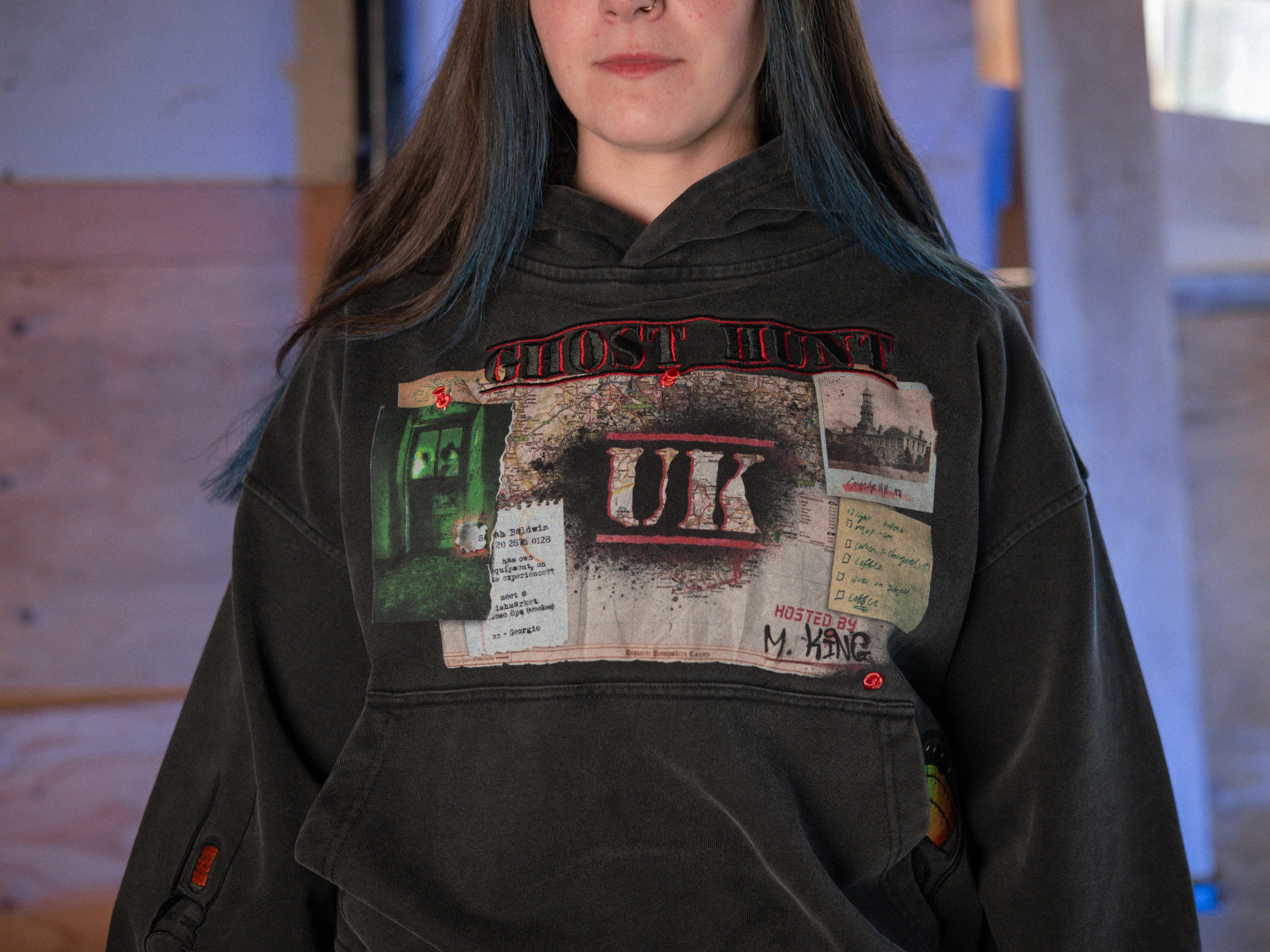 Rusty Quill X Knock Thrice 100% cotton hoodie in black, with a boxy, oversized, slightly cropped fit. The hoodie features both printed and embroidered details.