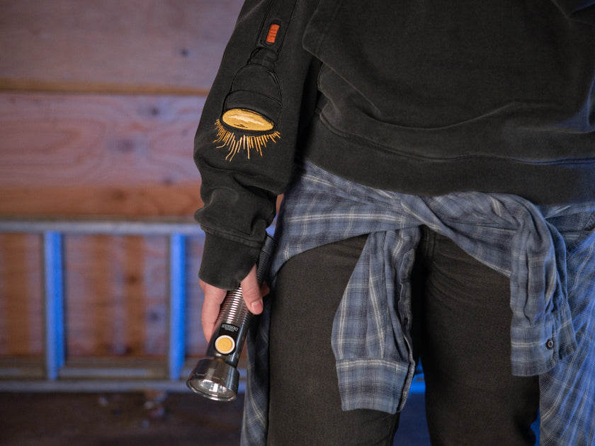 Rusty Quill X Knock Thrice 100% cotton hoodie in black, with a boxy, oversized, slightly cropped fit. The hoodie features both printed and embroidered details.