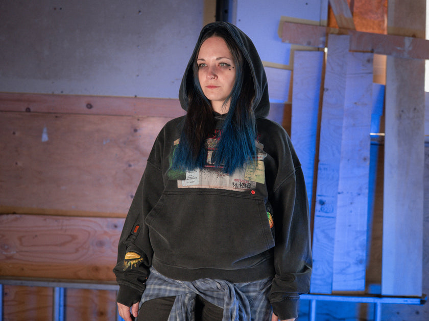 Rusty Quill X Knock Thrice 100% cotton hoodie in black, with a boxy, oversized, slightly cropped fit. The hoodie features both printed and embroidered details.