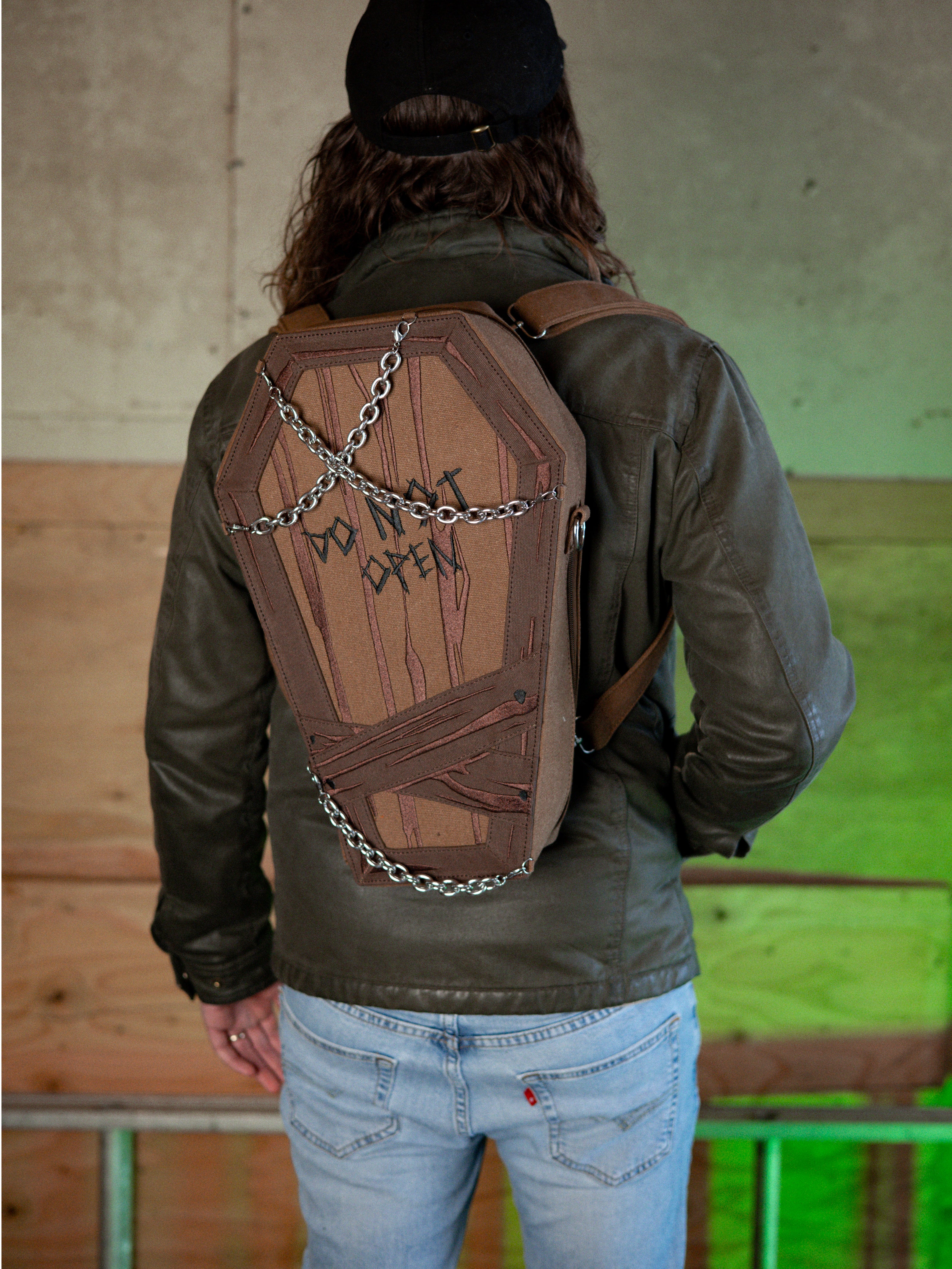 Knock Thrice X Rusty Quill 100% cotton canvas bag with customizable straps allow this bag to be worn as a purse, cross body or backpack. Real metal chains attach to exterior metal rings. Interior is 100% polyester print lining for easy cleaning. 
The bag is 29cm wide, 45cm long and 10cm deep. 