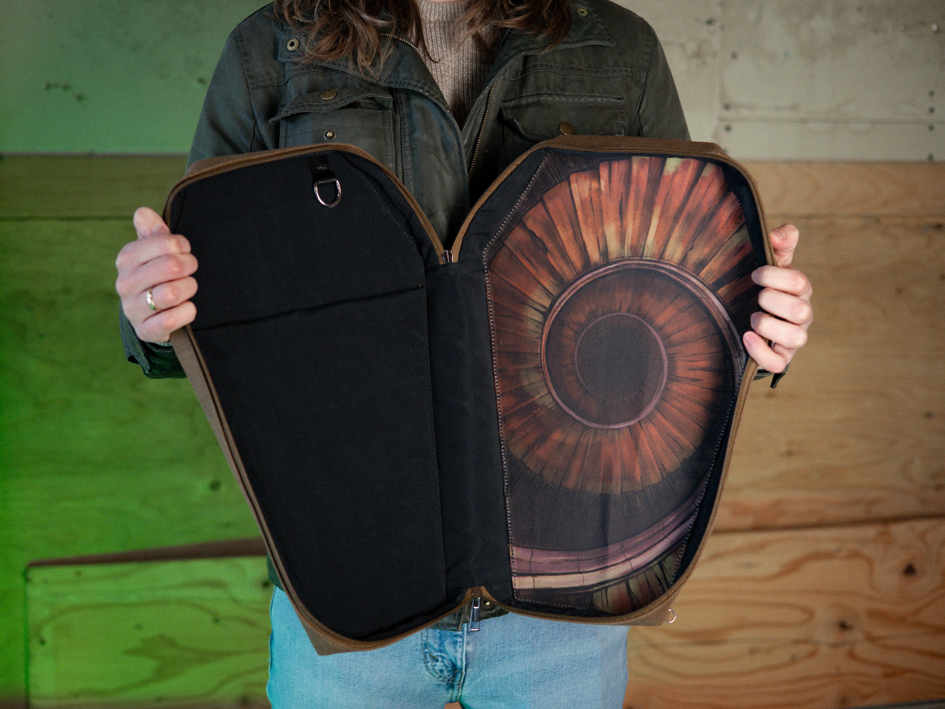 Knock Thrice X Rusty Quill 100% cotton canvas bag with customizable straps allow this bag to be worn as a purse, cross body or backpack. Real metal chains attach to exterior metal rings. Interior is 100% polyester print lining for easy cleaning. 
The bag is 29cm wide, 45cm long and 10cm deep. 