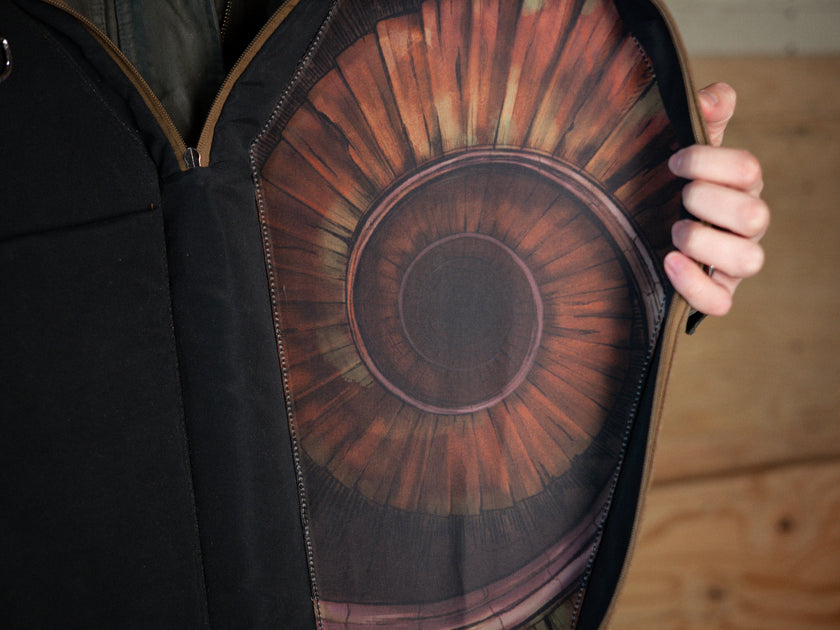 Knock Thrice X Rusty Quill 100% cotton canvas bag with customizable straps allow this bag to be worn as a purse, cross body or backpack. Real metal chains attach to exterior metal rings. Interior is 100% polyester print lining for easy cleaning. 
The bag is 29cm wide, 45cm long and 10cm deep. 