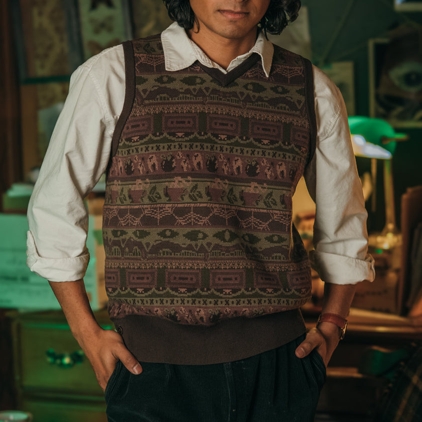 Magnus Archives x Knock Thrice knitted v-neck vest in dark green brown, and burgundy, made of 100% cotton.