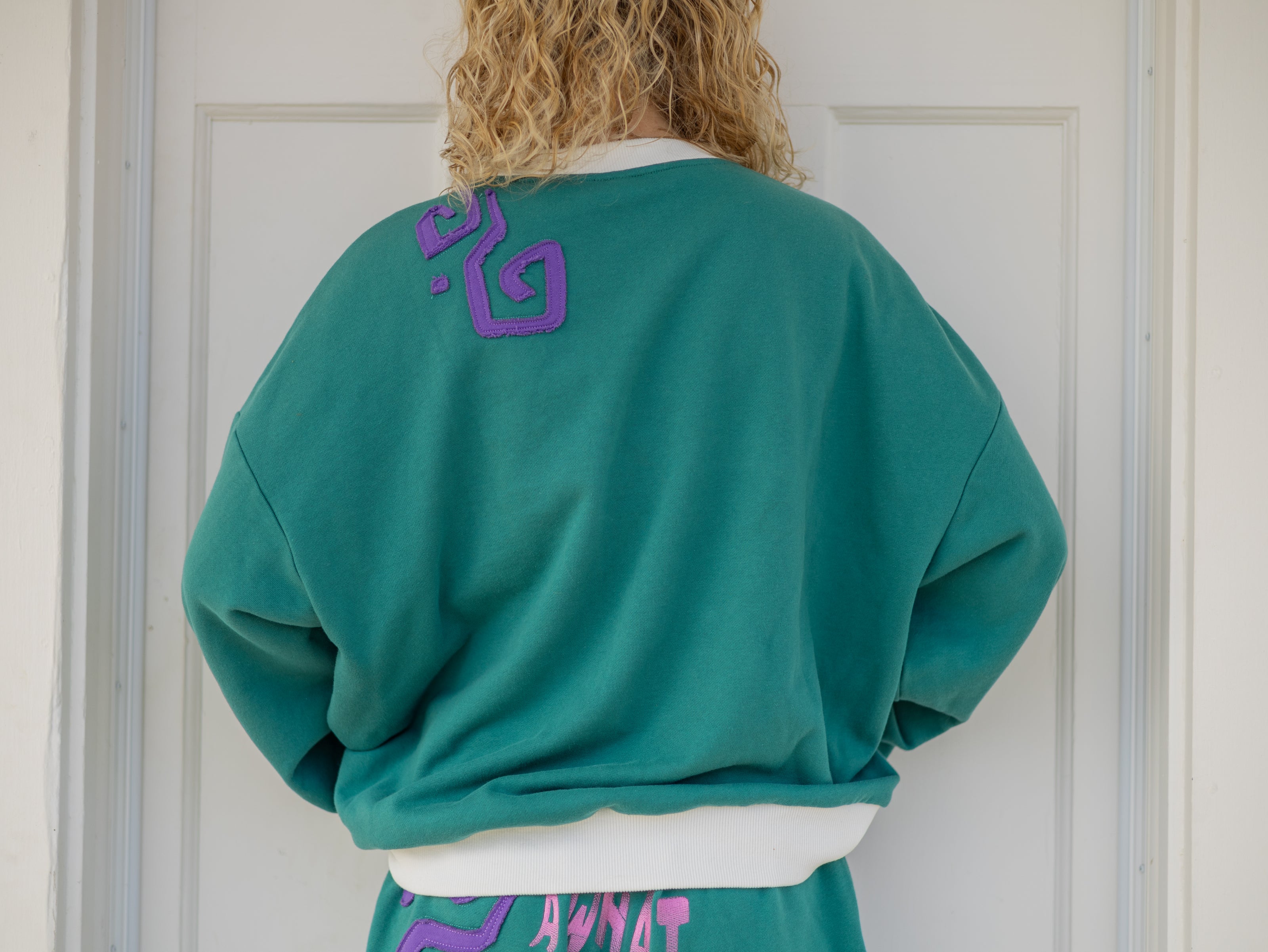 Magnus Archives x Knock Thrice “I’m Not a Who” 100% cotton, graphic crewneck in green and purple, with embroidered details.