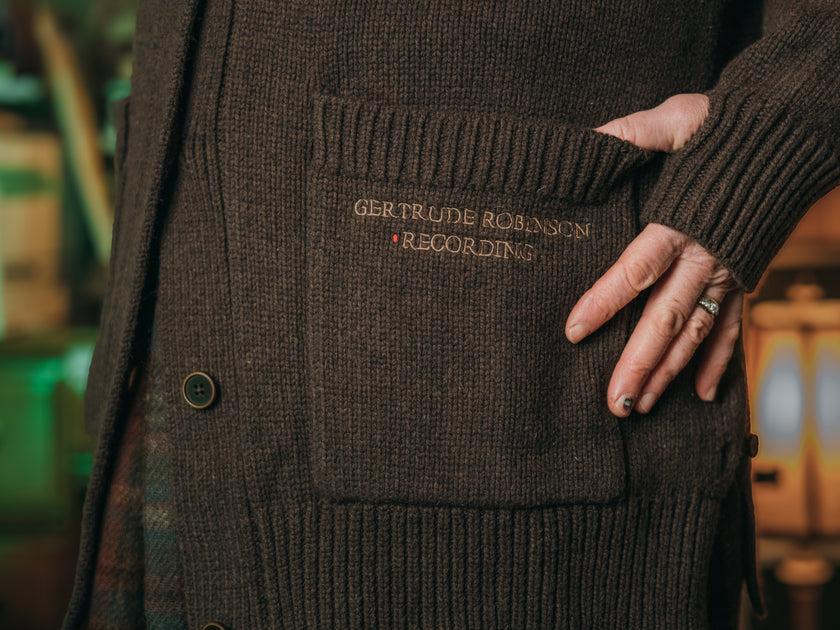 Magnus Archives x Knock Thrice oversized knit cardigan with embroidered details in dark brown. Made of 60% Cotton 30% Nylon 10% Wool.