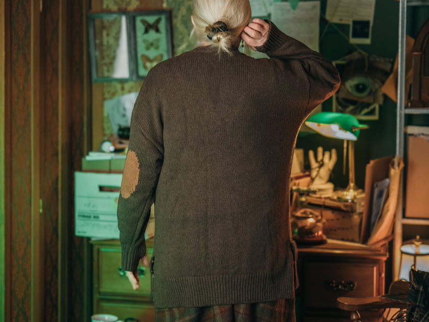 Magnus Archives x Knock Thrice oversized knit cardigan with embroidered details in dark brown. Made of 60% Cotton 30% Nylon 10% Wool.