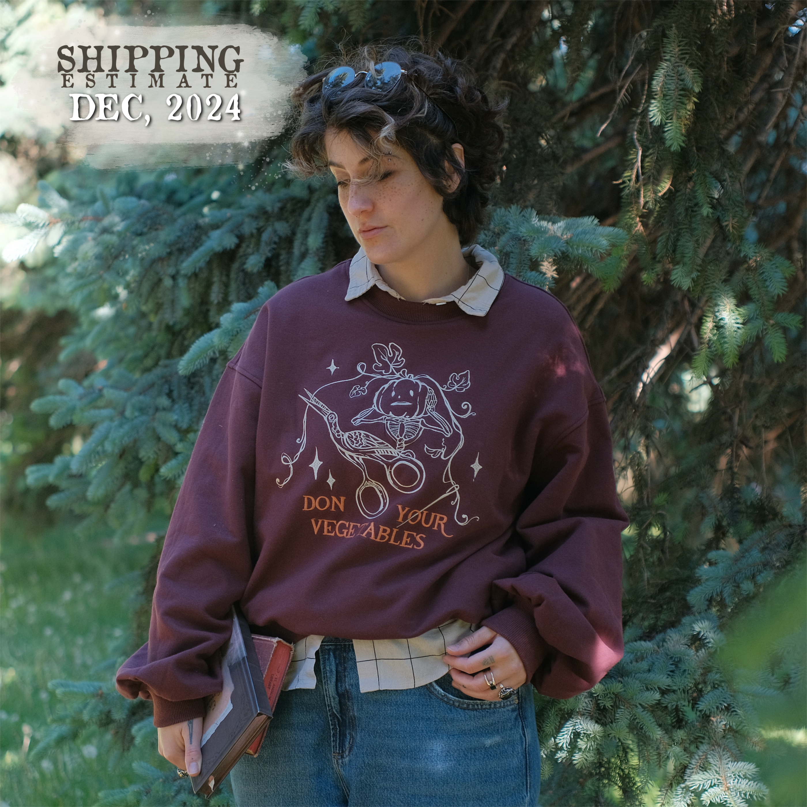 Cozy, oversized, puff-sleeved, cotton with fleece-lining, crewneck sweater in burgundy. The sweater features an intricately embroidered design in white and orange, of a pumpkin skeleton, vines, stork scissors, and reads â€œDon Your Vegetablesâ€.