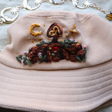 Load image into Gallery viewer, Patron Hat: The Protector // Creamy Tea Bucket Hat
